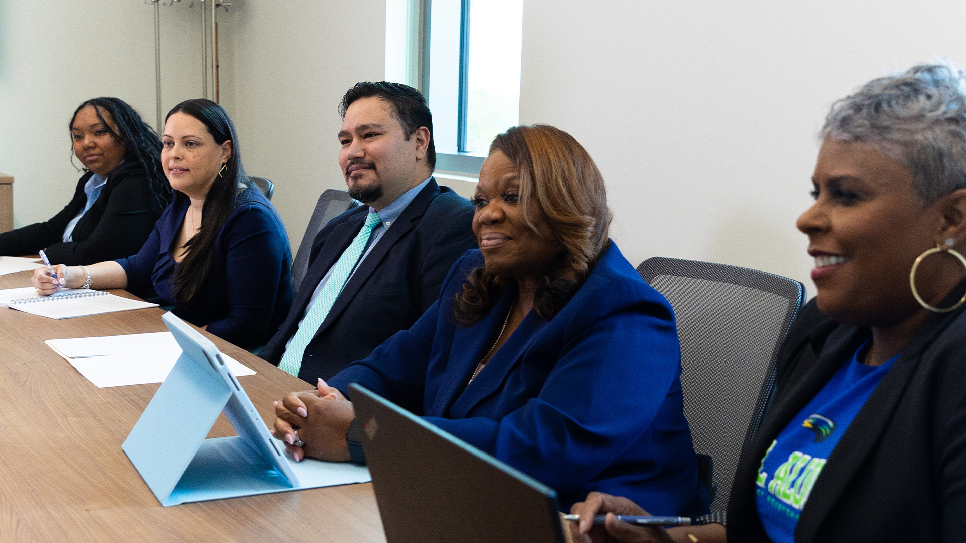 Students at a conference table