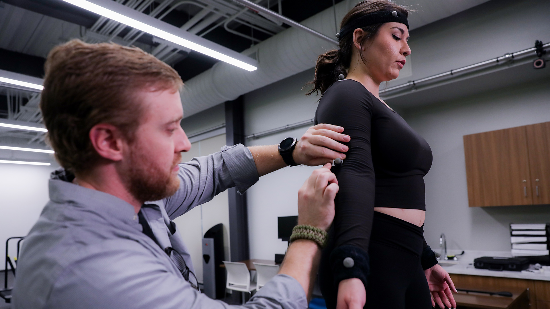 UHCL staff measuring an individual to determine motion capture