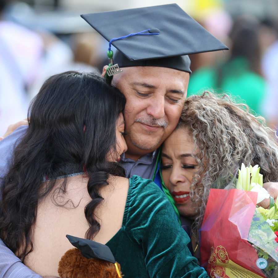  UHCL Commencement, Student Hugging Family