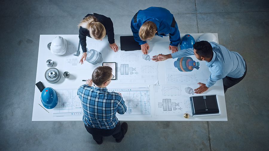 An arial view of a team around a design table