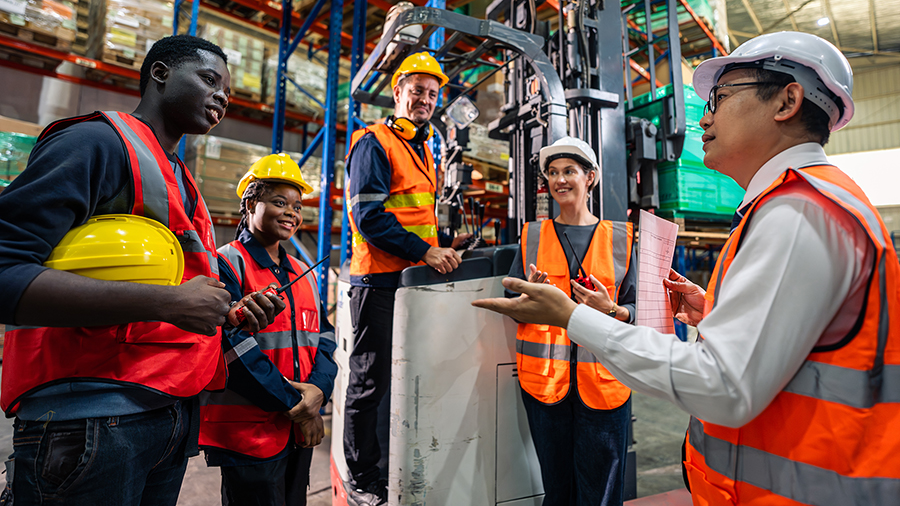 Photo of a group of individuals inside a warehouse